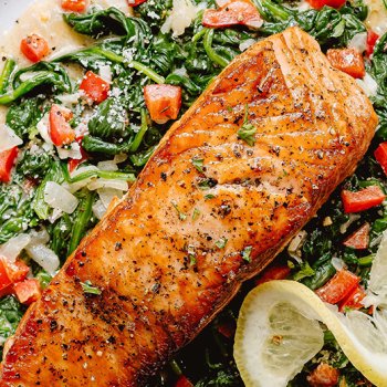 This easy grilled salmon recipe is made with a pan-seared salmon fillet served on a wholesome, creamy bed of spinach and feels like a restaurant-quality dinner! Keto-friendly, low carb, and gluten-free, you can make this salmon recipe in less than 30mn from start to finish.